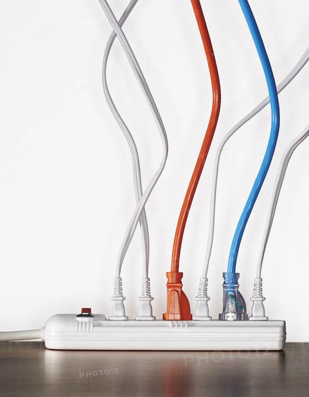 Close up of cords plugged into power strip