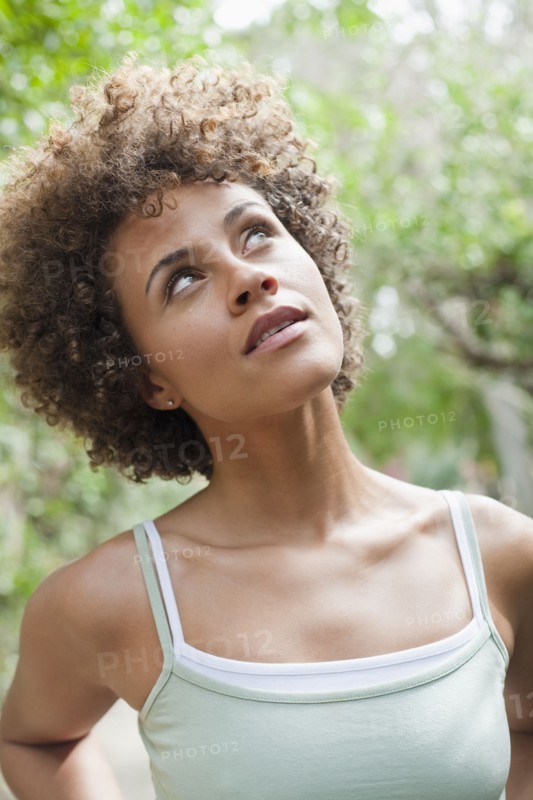 Mixed race woman looking up