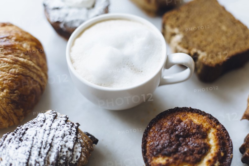 Close up of variety of pastries and coffee