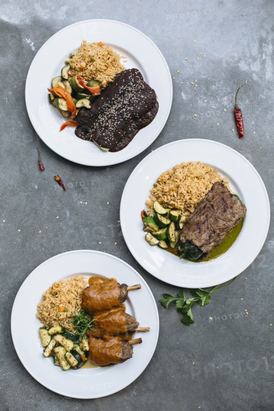 Plates of food with vegetables and rice