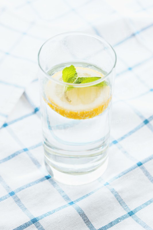 Close up of glass of herbal lemon water