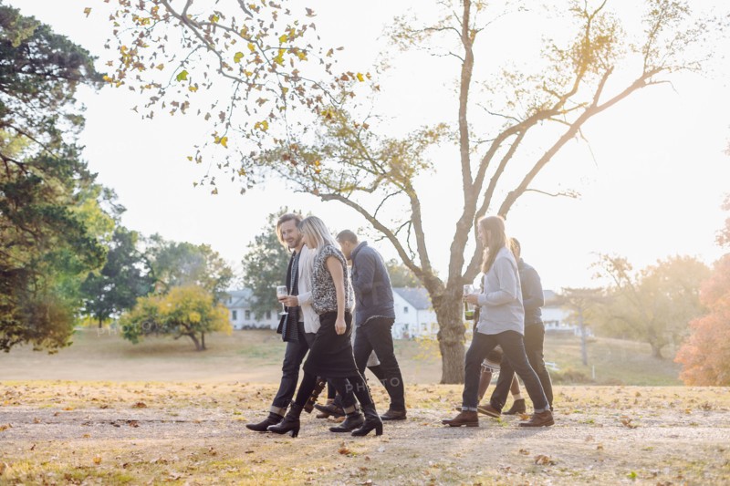 Friends walking in rural field