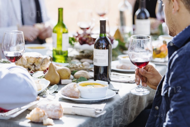 Friends eating at outdoor table