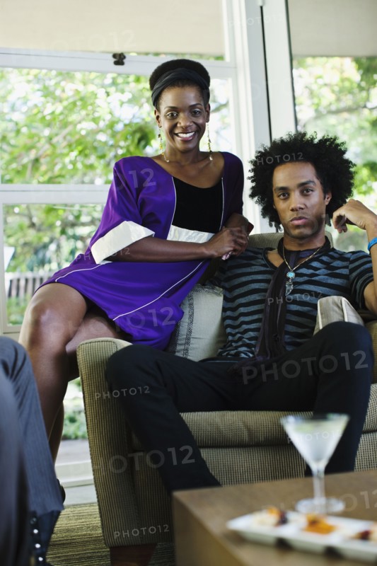 African American woman at cocktail party with boyfriend