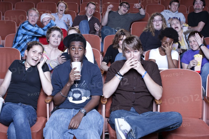 Friends watching movie in theater