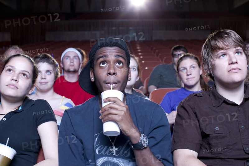 Friends watching movie in theater
