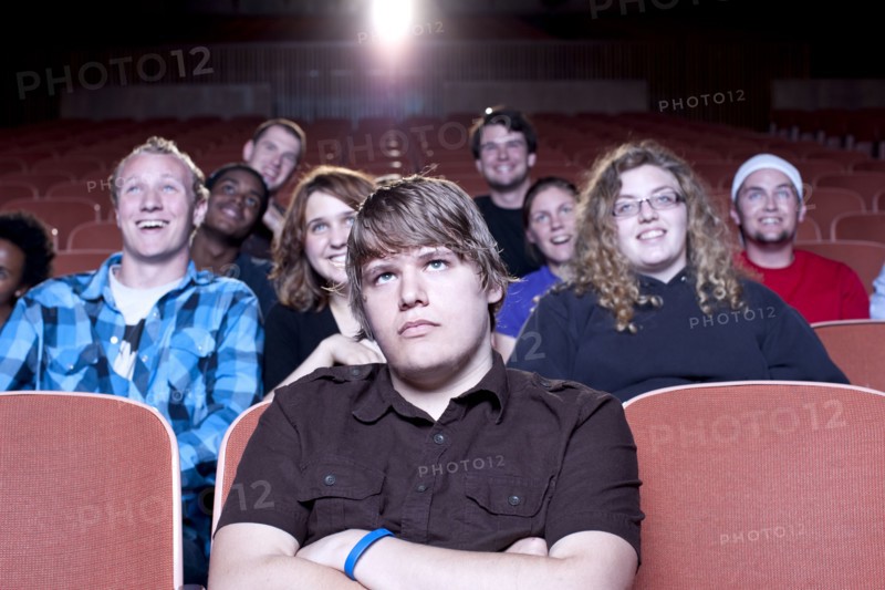Friends watching movie in theater
