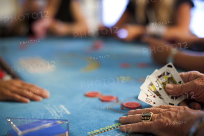People playing poker in casino