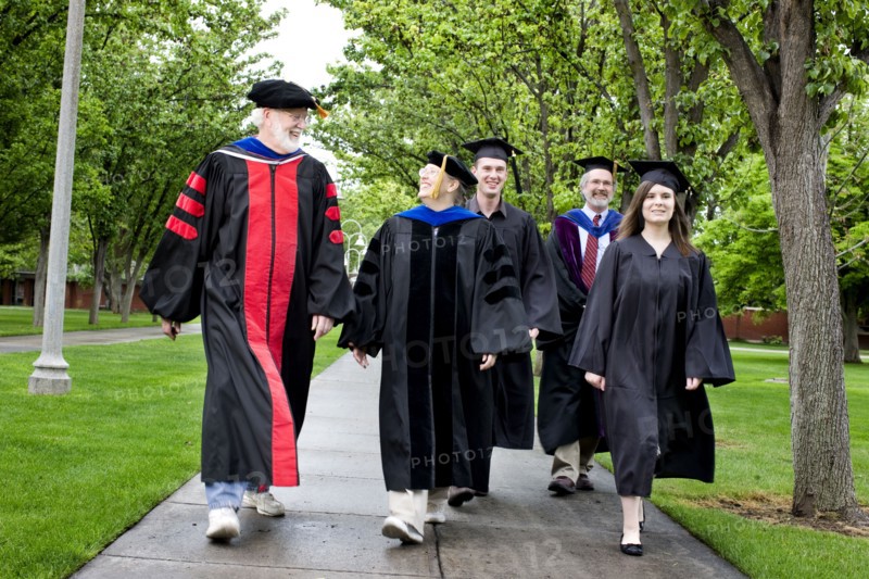 Professors and students walking to graduation