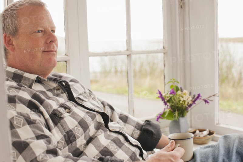 Caucasian man relaxing and drinking coffee