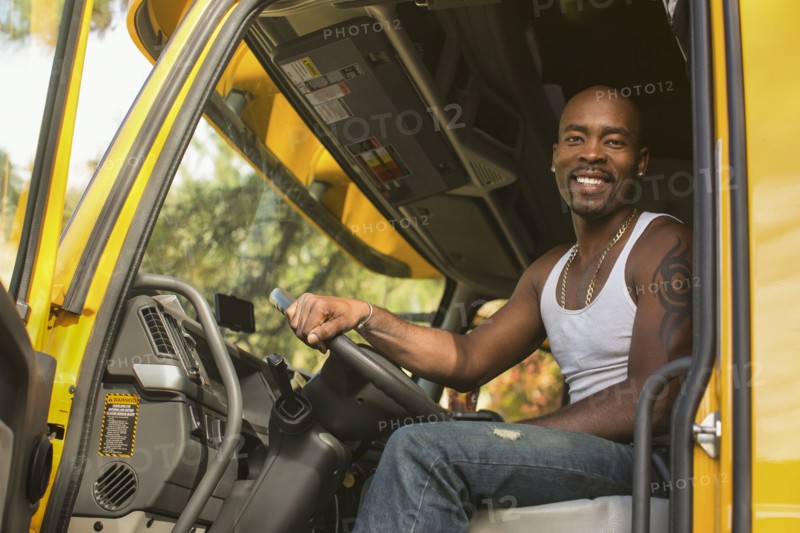 Black man smiling in truck