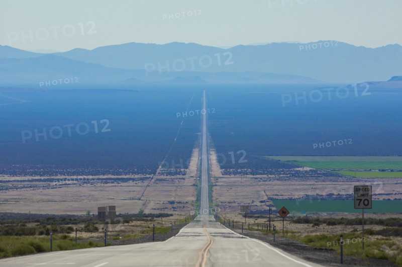 Long road through rural landscape