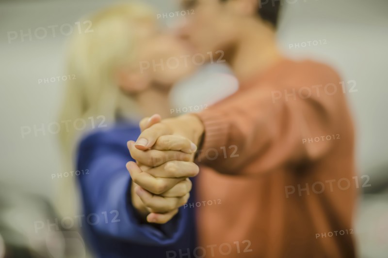 Caucasian couple holding hands