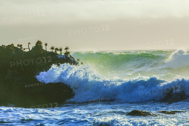 Waves crashing on cliffs