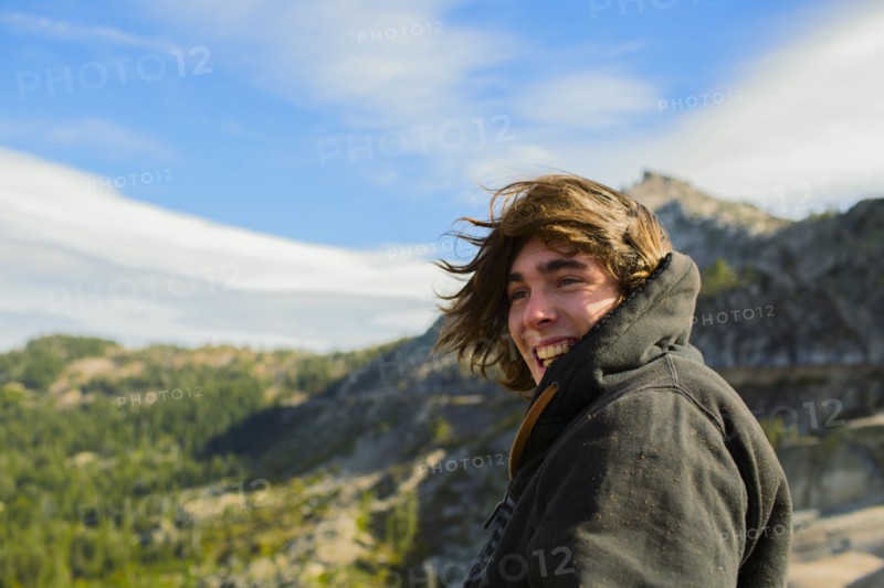 Caucasian man smiling in rural landscape
