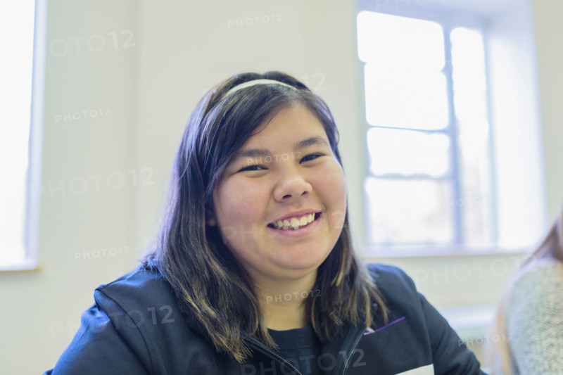 Native American student smiling in class
