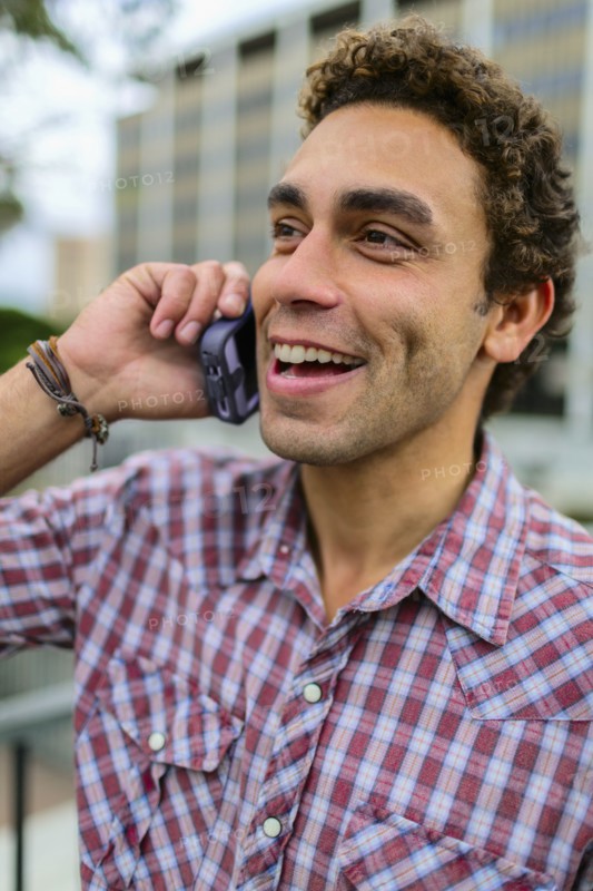 Hispanic man talking on cell phone