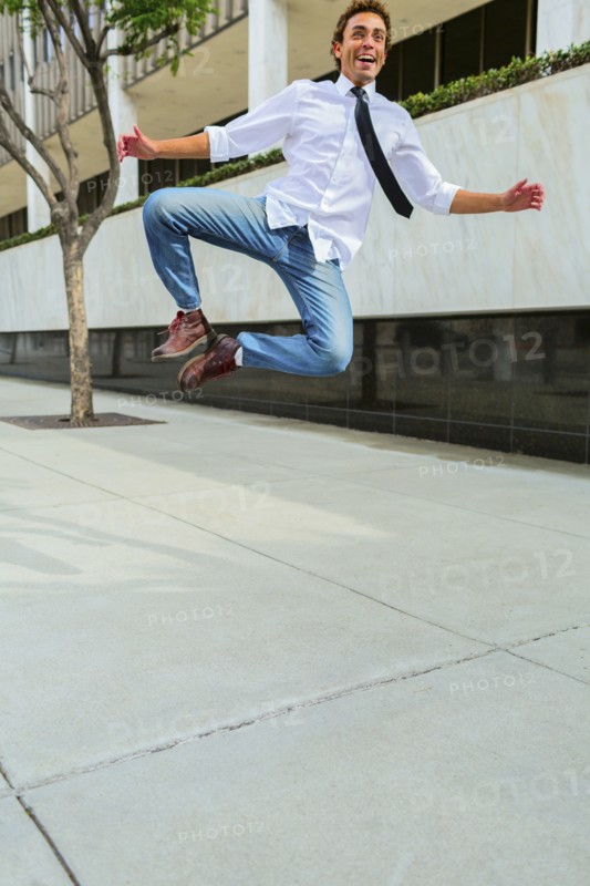 Hispanic businessman clicking his heels