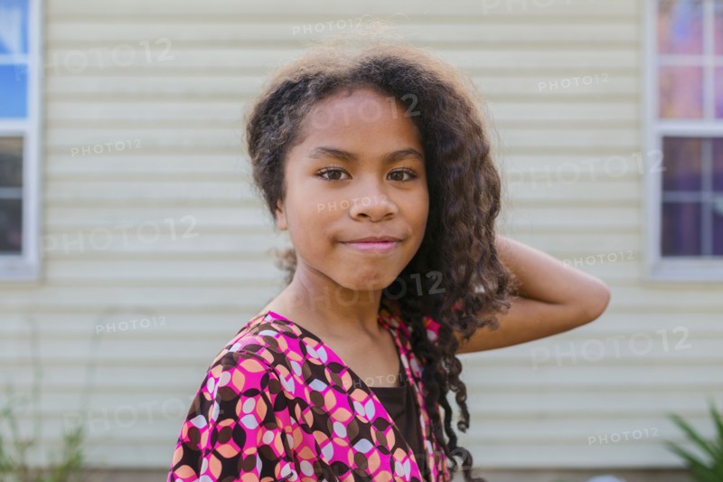 Pacific Islander girl smiling outdoors