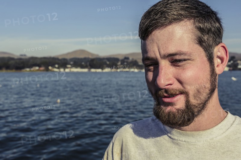 Caucasian man standing near bay