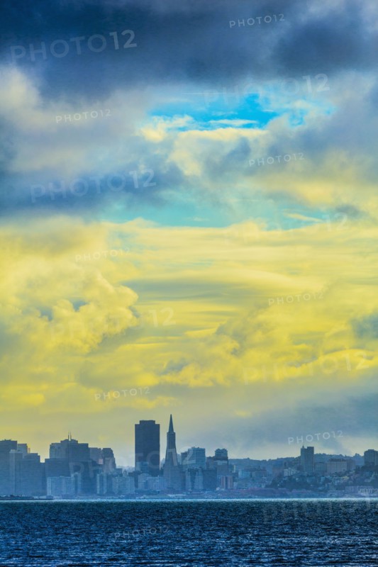 Silhouette of San Francisco city skyline under sunset sky
