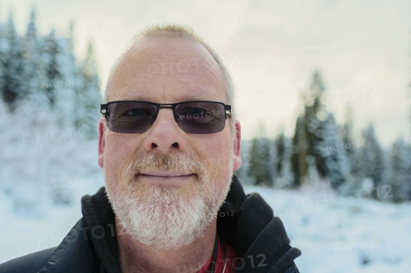 Caucasian man in snowy field