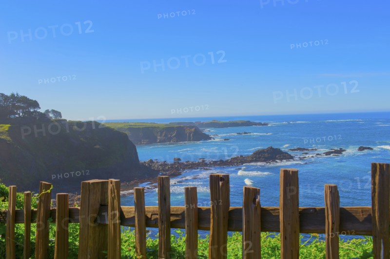 Wood fence overlooking rocky coastline