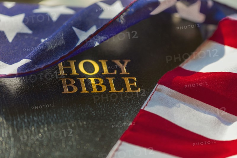 American flag draped over bible