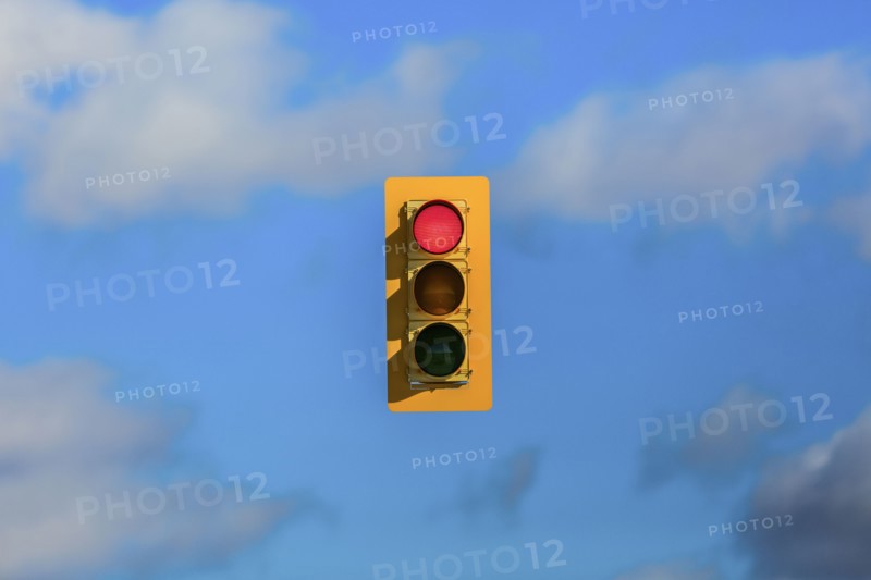 Stoplight floating in sky