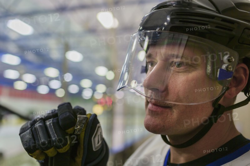 Caucasian hockey player wearing helmet
