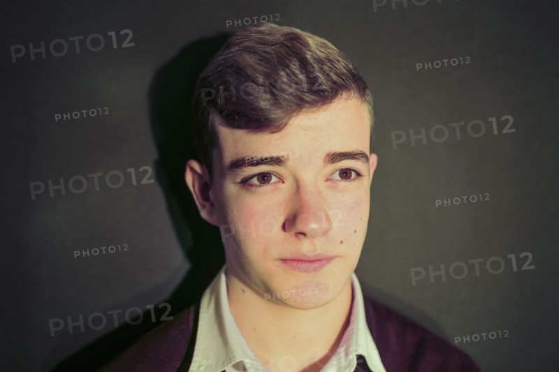 Caucasian teenage boy with serious expression