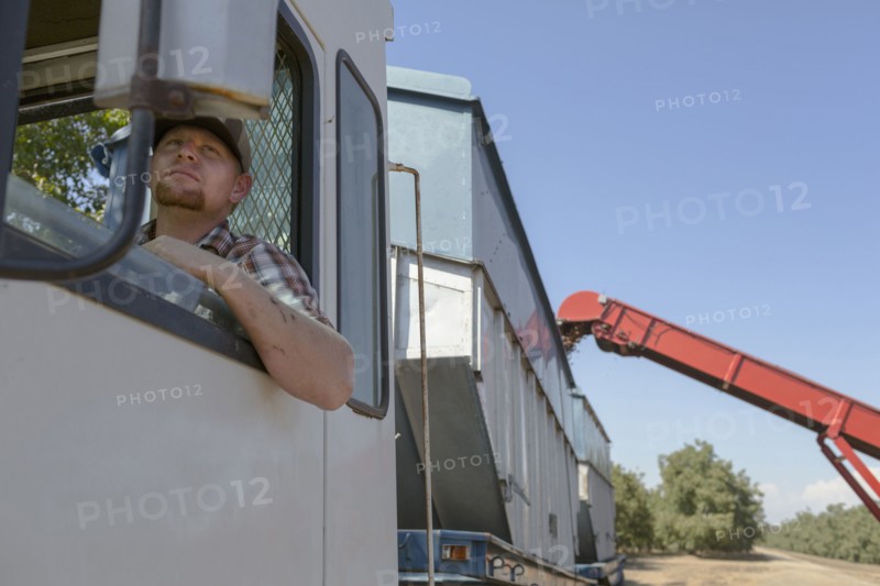 Caucasian man watching harvester
