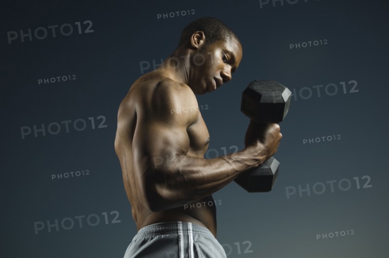 African American man lifting weights