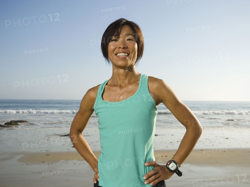 Asian woman with hands on hips