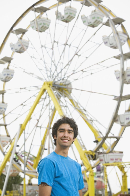 Mixed Race teenaged boy at carnival