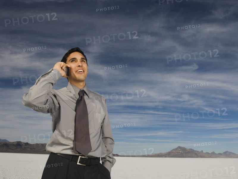Hispanic businessman talking on cell phone