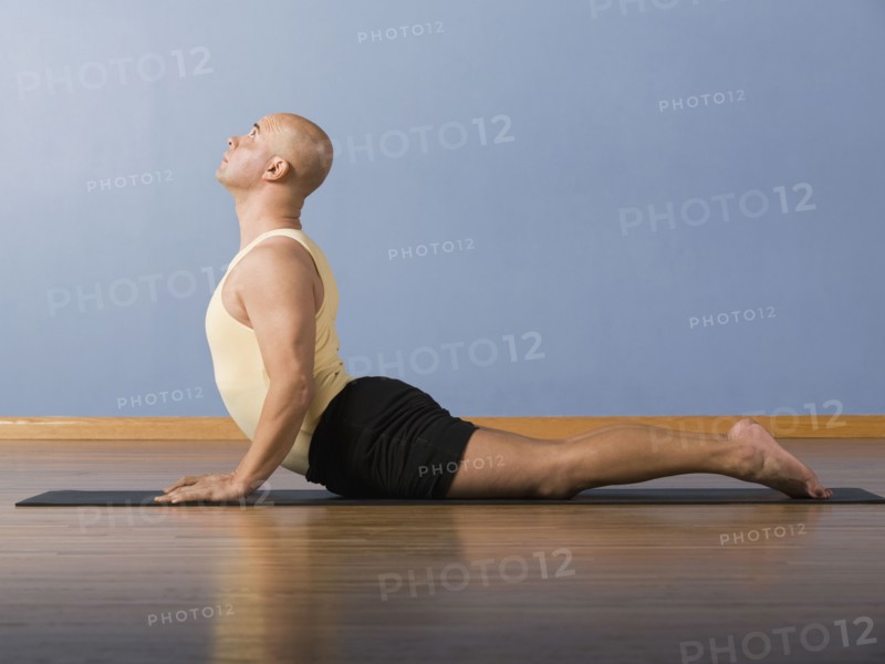 Hispanic man practicing yoga
