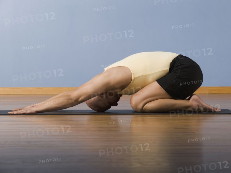 Hispanic man practicing yoga