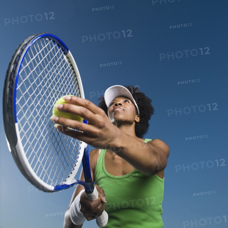 African woman playing tennis