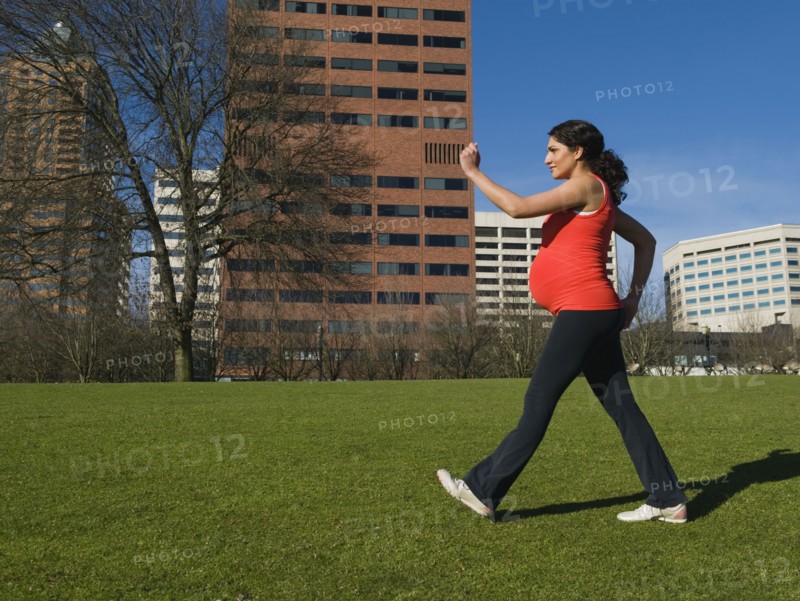 Pregnant Middle Eastern woman walking for exercise