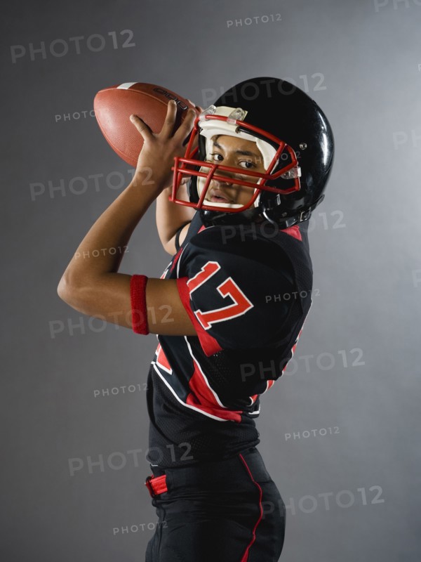 Mixed race quarterback ready to throw football