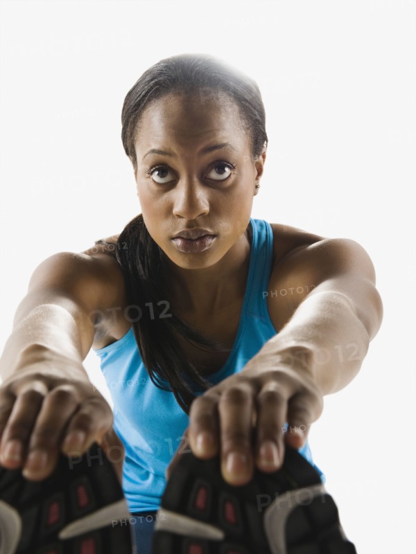 Mixed race runner stretching