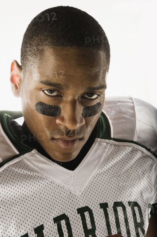 African football player with face paint under eyes