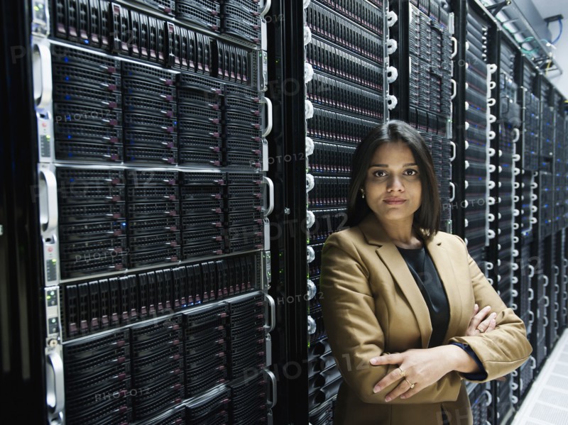 Indian businesswoman standing in server room