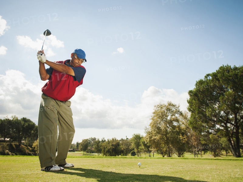 Black man playing golf