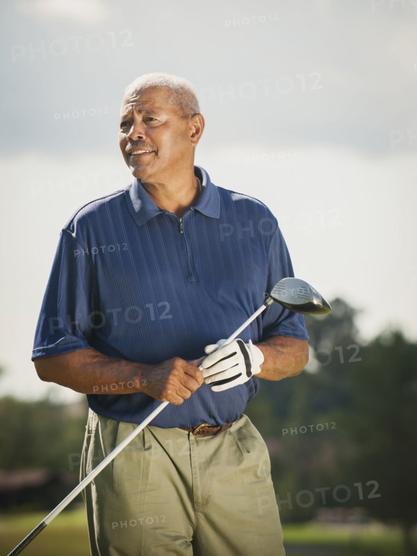 Black man playing golf