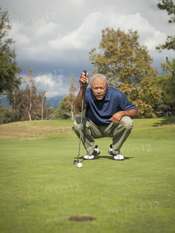 Black man playing golf