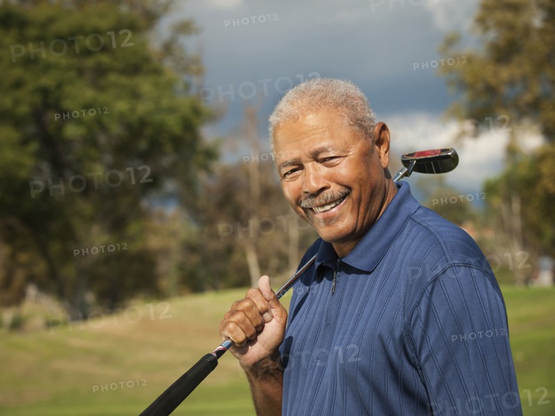 Black man playing golf