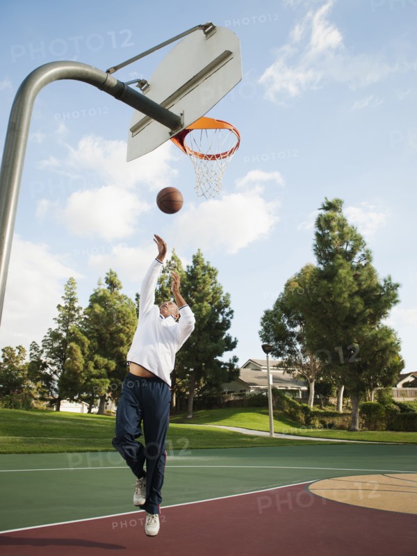 Black man playing basketball
