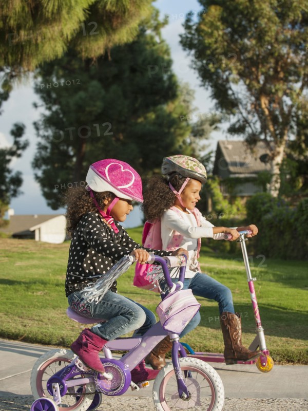 Mixed race girls playing outdoors